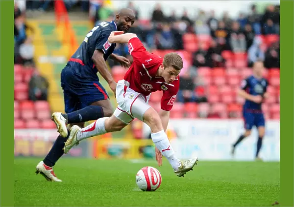 Intense Rivalry: A Battle of Wits - Ribeiro vs. Adebola in the Championship Clash between Bristol City and Nottingham Forest, April 2010