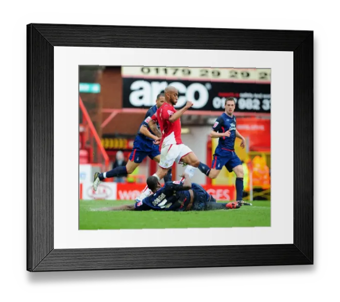 Framed Print : Wes Morgan Stops Danny Haynes: Intense Moment from the 2010 Championship Clash between Bristol City and Nottingham Forest Framed Print : Wes Morgan Stops Danny Haynes: Intense Moment from the 2010 Championship Clash between Bristol City and Nottingham Forest