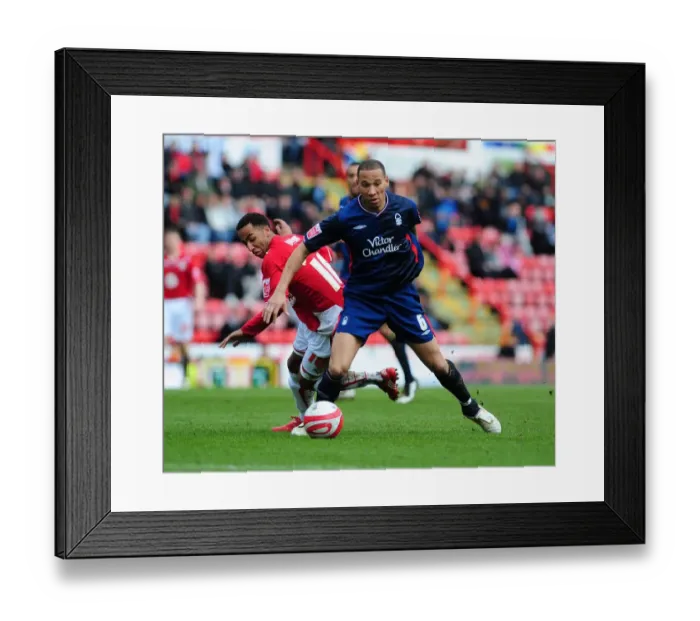 Framed Print : Nicky Maynard's Pivotal Slip Past Kelvin Wilson: A Moment to Remember in the 2010 Championship Clash Between Bristol City and Nottingham Forest Framed Print : Nicky Maynard's Pivotal Slip Past Kelvin Wilson: A Moment to Remember in the 2010 Championship Clash Between Bristol City and Nottingham Forest