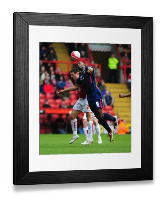 Framed Print : Bradley Orr vs. Dele Adebola: Aerial Battle in the Championship Clash between Bristol City and Nottingham Forest - 03 / 04 / 2010 Framed Print : Bradley Orr vs. Dele Adebola: Aerial Battle in the Championship Clash between Bristol City and Nottingham Forest - 03 / 04 / 2010