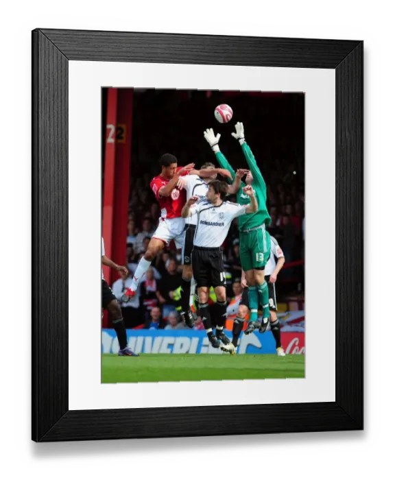 Framed Print : Bristol City vs Derby County: Nyatanga's Aerial Battle with Deeney and Barker, Championship Match, April 2010 Framed Print : Bristol City vs Derby County: Nyatanga's Aerial Battle with Deeney and Barker, Championship Match, April 2010