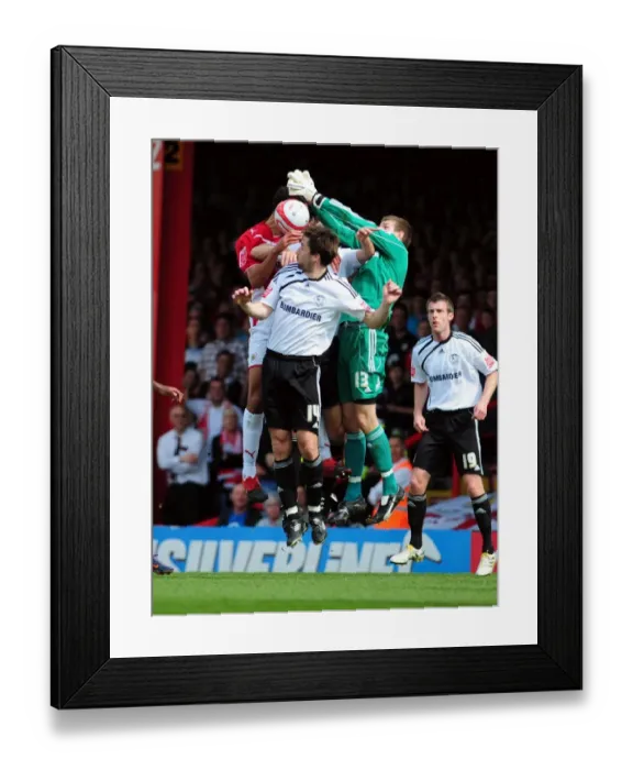 Framed Print : Bristol City's Lewin Nyatanga Contests Aerial Ball against Derby County's Saul Deeney and Shaun Barker - Championship Clash, April 2010 Framed Print : Bristol City's Lewin Nyatanga Contests Aerial Ball against Derby County's Saul Deeney and Shaun Barker - Championship Clash, April 2010