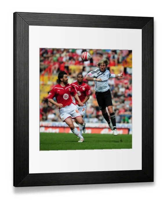 Framed Print : Clash at Ashton Gate: Robbie Savage and Paul Hartley Battle for Aerial Supremacy in Derby County vs. Bristol City Championship Showdown, 2010 Framed Print : Clash at Ashton Gate: Robbie Savage and Paul Hartley Battle for Aerial Supremacy in Derby County vs. Bristol City Championship Showdown, 2010