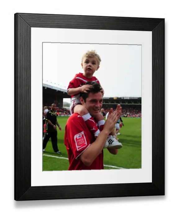Framed Print : Bristol City's Ivan Sproule and Son: A Heartwarming Moment at Ashton Gate Stadium (Bristol City v Derby County, Championship, 2010)