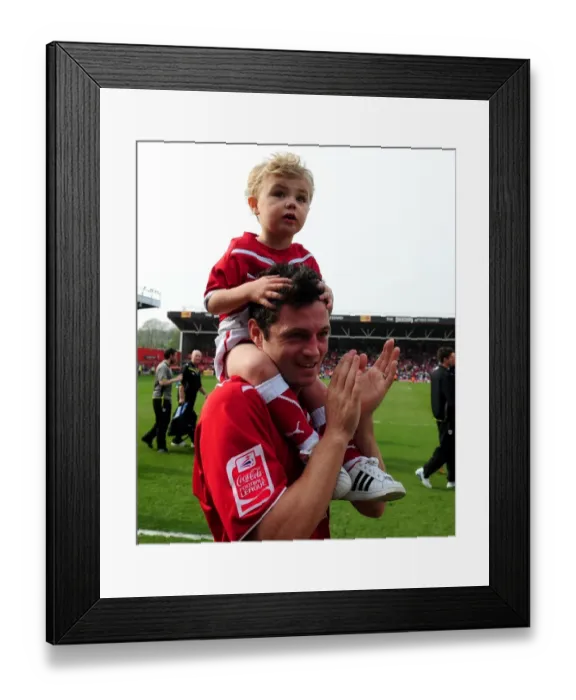 Framed Print : A Heartwarming Moment: Ivan Sproule of Bristol City Shares the Pitch with His Son during the 2010 Championship Match against Derby County Framed Print : A Heartwarming Moment: Ivan Sproule of Bristol City Shares the Pitch with His Son during the 2010 Championship Match against Derby County