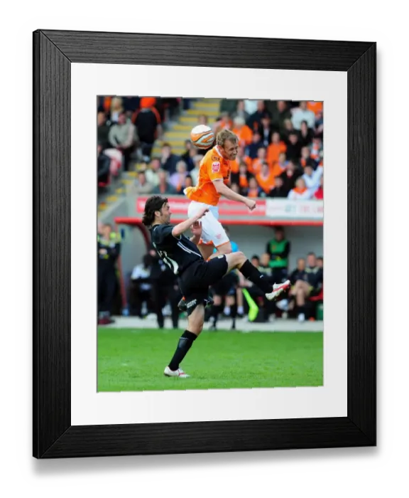 Framed Print : Ormerod vs Hartley: Aerial Battle in the Championship Clash between Blackpool and Bristol City - 02 / 05 / 2010