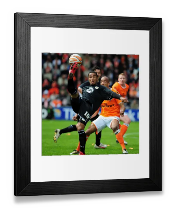 Framed Print : Nicky Maynard Flips Over John-Baptiste: Championship Clash Between Blackpool and Bristol City - 02 / 05 / 2010 Framed Print : Nicky Maynard Flips Over John-Baptiste: Championship Clash Between Blackpool and Bristol City - 02 / 05 / 2010