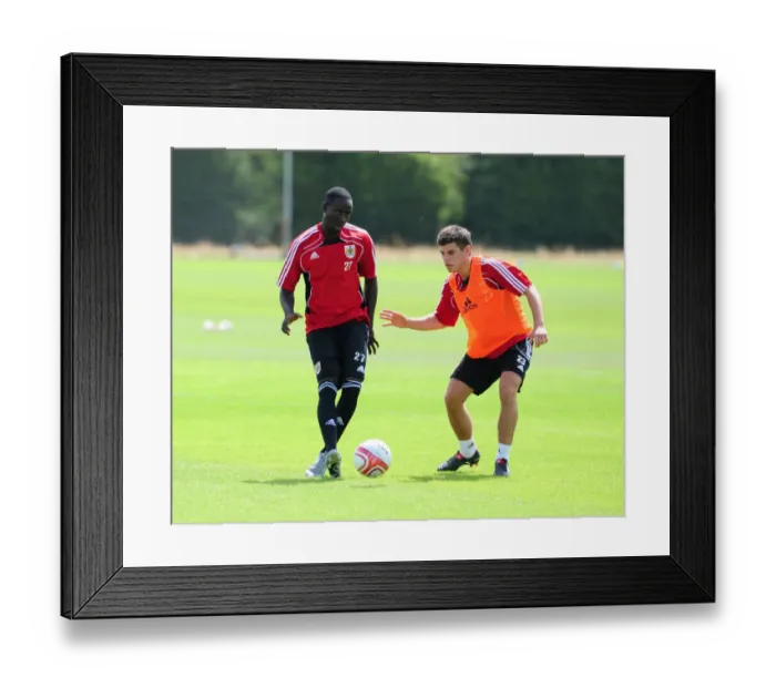 Framed Print : Bristol City: Intense Training Moment - Albert Adomah vs. Joe Edwards Battling for the Ball Framed Print : Bristol City: Intense Training Moment - Albert Adomah vs. Joe Edwards Battling for the Ball