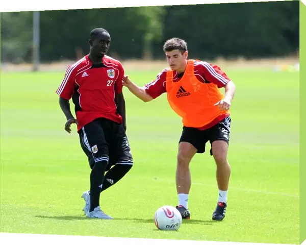 Bristol Citys Albert Adomah challenges for the ball with Bristol Citys Joe Edwards