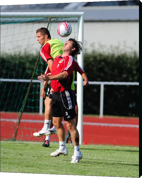 Bristol Citys Jamie McAllister challenges for the ariel ball with Trialist John O Flynn