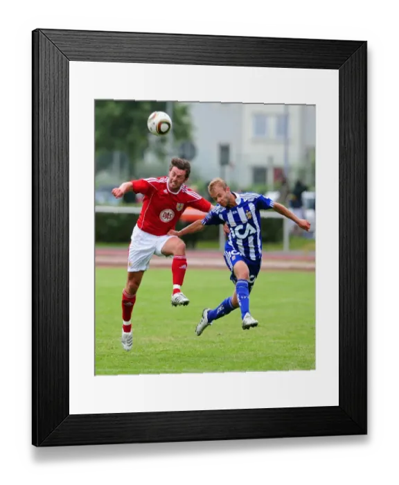 Framed Print : Bristol Citys Cole Skuse challenges for the ariel ball