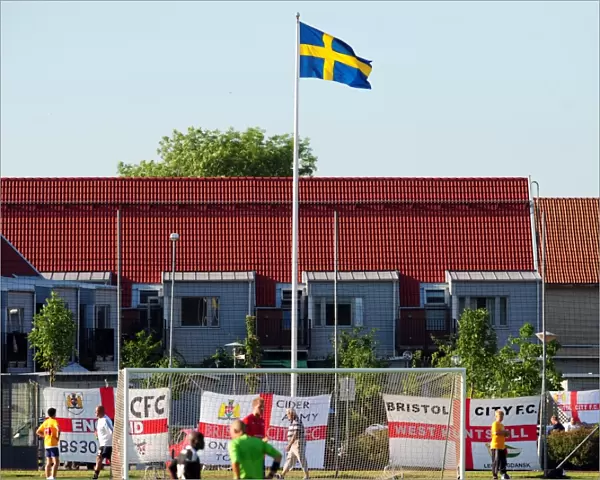 Bristol City fans decorate the ground with flags below the Swedish flag