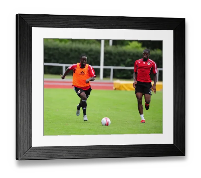 Framed Print : Bristol City: Intense Training Moment - Albert Adomah and John Akinde Compete for the Ball