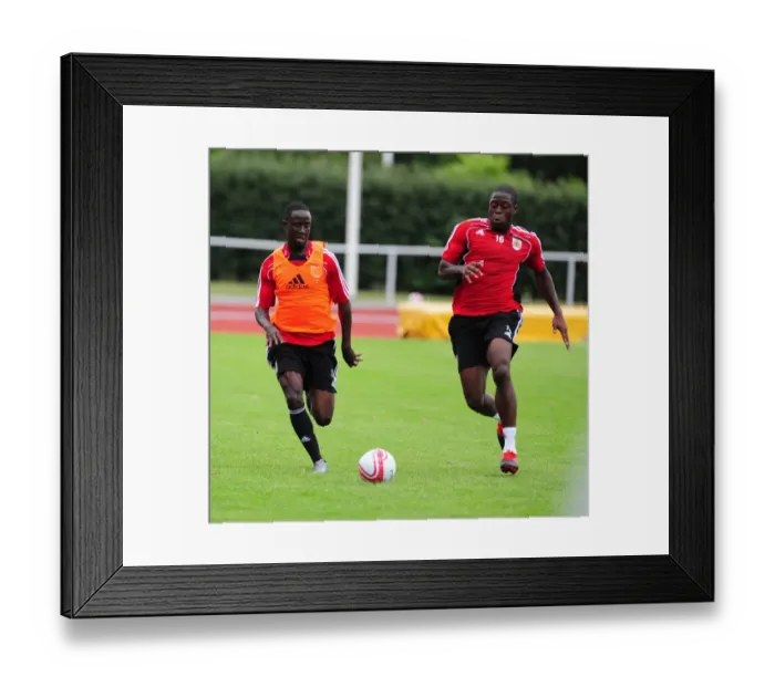 Framed Print : Bristol Citys Albert Adomah battles for the ball with Bristol Citys John Akinde Framed Print : Bristol Citys Albert Adomah battles for the ball with Bristol Citys John Akinde