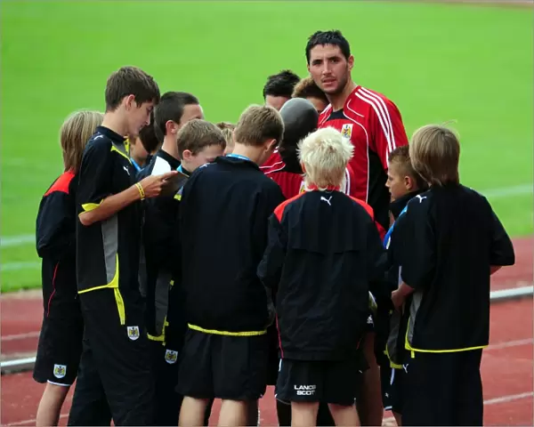 First team players sign autographs for the academy players