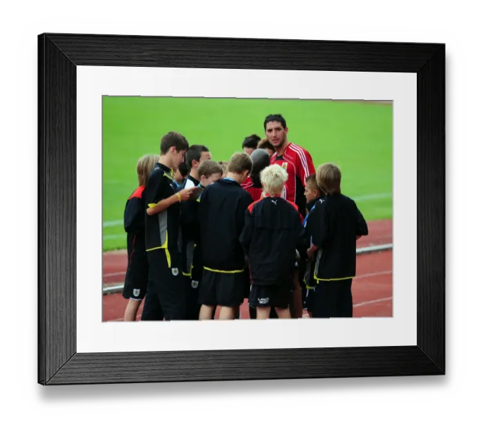 Framed Print : First team players sign autographs for the academy players