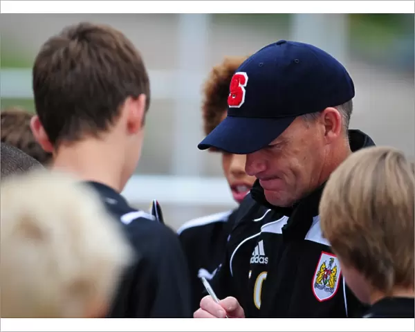 Bristol City Manager, Steve Coppell signs autographs for the academy players