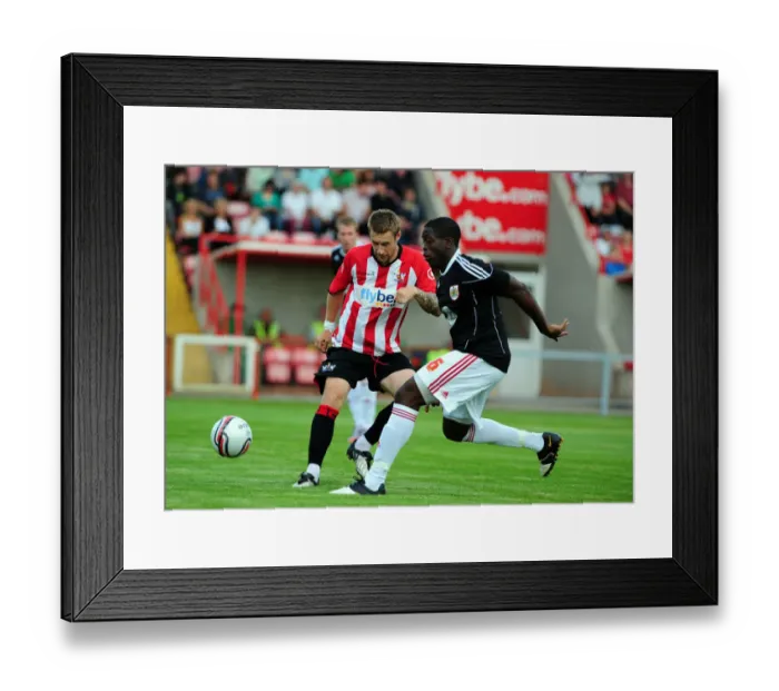 Framed Print : David Noble is tackled by Bristol Citys John Akinde Framed Print : David Noble is tackled by Bristol Citys John Akinde