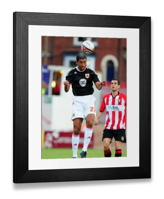 Framed Print : Bristol Citys Lewin Nyatanga heads clear