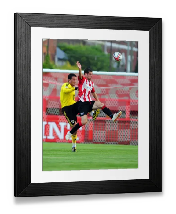 Framed Print : Bristol City's Stephen Henderson Clears Under Pressure Against Exeter City