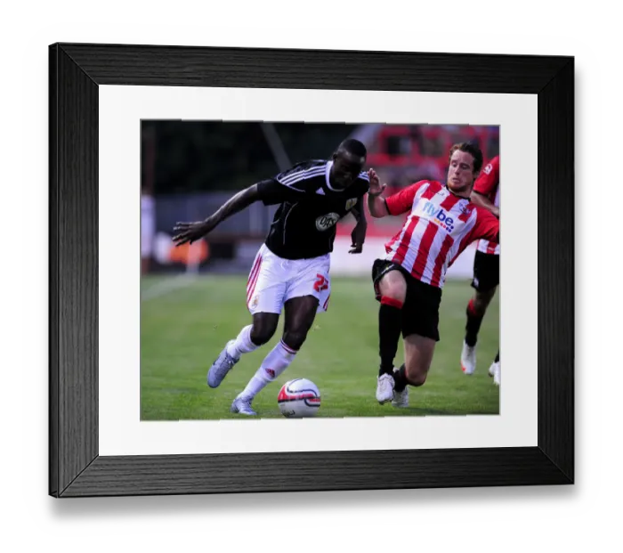 Framed Print : Bristol Citys Albert Adomah is fouled by Ryan Harley