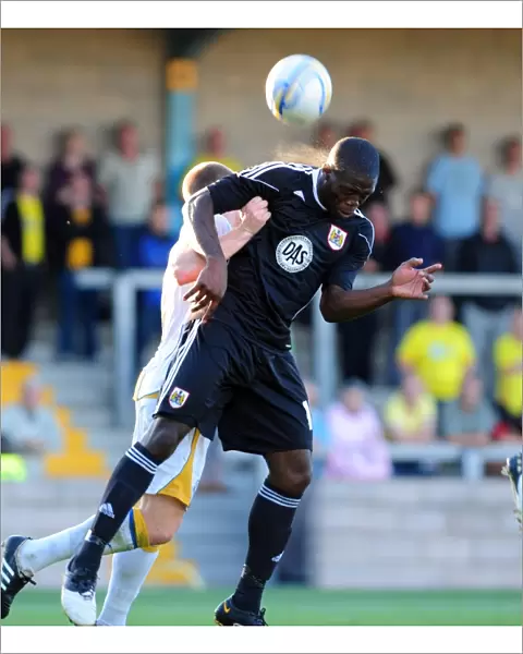Bristol Citys John Akinde challenges for the ariel ball