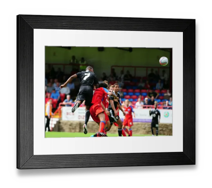Framed Print : Marvin Elliott's Determined Charge Towards Aldershot's Goal Framed Print : Marvin Elliott's Determined Charge Towards Aldershot's Goal