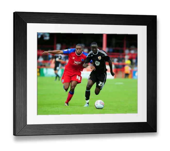 Framed Print : Adomah vs. Panther: Intense Battle for Ball Possession (Aldershot vs. Bristol City)