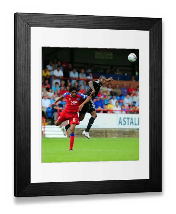 Framed Print : Bristol Citys Marvin Elliott challenges for the ariel ball with Aldershots Anthony Charles Framed Print : Bristol Citys Marvin Elliott challenges for the ariel ball with Aldershots Anthony Charles