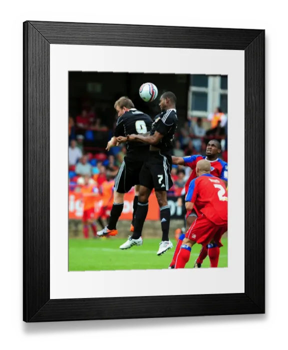 Framed Print : Bristol City's Marvin Elliott and David Clarkson Contest for Aerial Ball in Action- Packed Aldershot Match