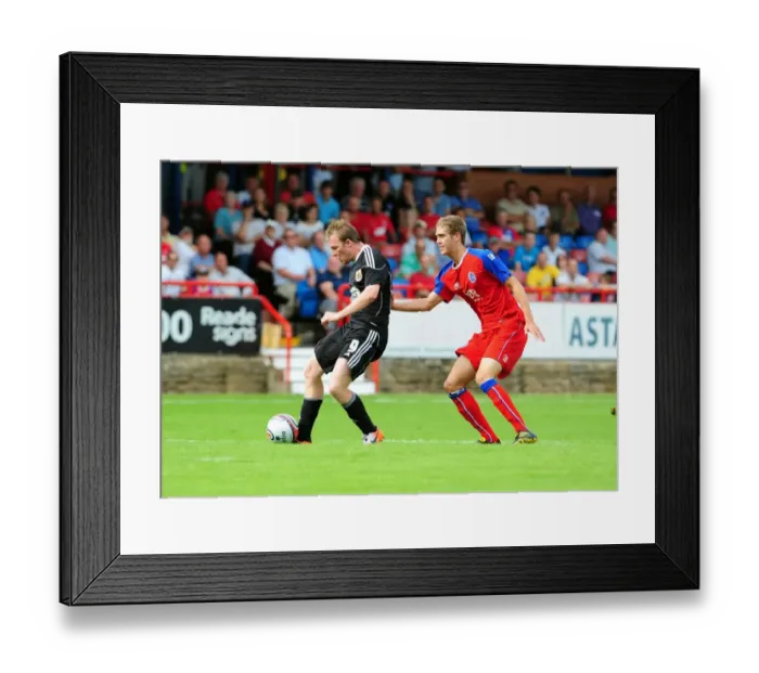 Framed Print : David Clarkson's Dramatic Post-Hit: Aldershot vs. Bristol City