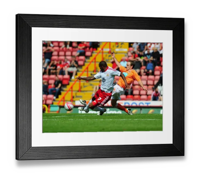 Framed Print : Bristol City vs Blackpool: Marvin Elliott's Battle for the Ball - Championship Football Match, 2010 Framed Print : Bristol City vs Blackpool: Marvin Elliott's Battle for the Ball - Championship Football Match, 2010