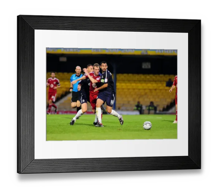 Framed Print : Clash at Roots Hall: David Clarkson's Battle for Possession vs Graham Coughlan and Sofiene Zaaboub, Carling Cup, Southend United vs Bristol City