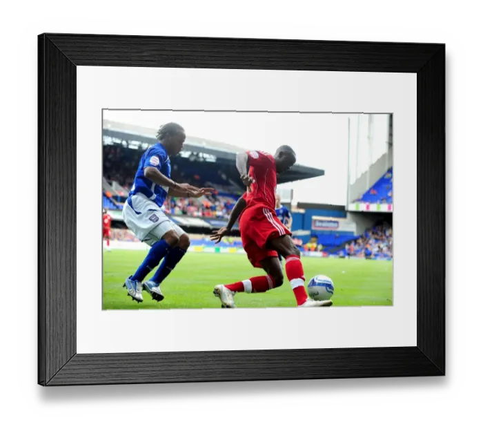 Framed Print : Adomah vs. Peters: Battle for Ball Possession in Ipswich v Bristol City Championship Clash (August 2010)