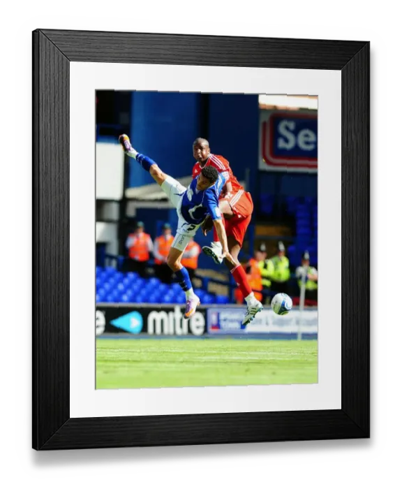 Framed Print : Clash in the Sky: Cisse vs. Edwards - Championship Showdown (August 2010) - Ipswich v Bristol City: Kalifa Cisse Challenges Carlos Edwards for the Aerial Ball