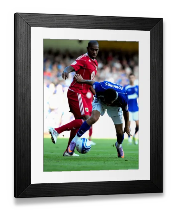 Framed Print : Battling for Supremacy: Marvin Elliott vs. Carlos Edwards in the Championship Clash between Ipswich and Bristol City (August 2010) Framed Print : Battling for Supremacy: Marvin Elliott vs. Carlos Edwards in the Championship Clash between Ipswich and Bristol City (August 2010)