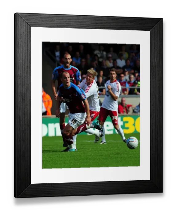 Framed Print : Battling for Supremacy: Jon Stead vs. David Mirfin in the Championship Clash between Scunthorpe United and Bristol City (September 11, 2010)