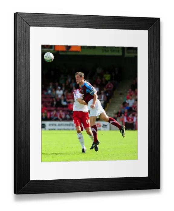 Framed Print : Clash in the Sky: Byrne vs. Skuse at Glanford Park - Scunthorpe United vs. Bristol City, Championship Football, 2010