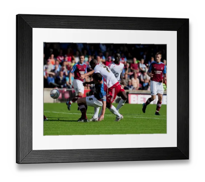 Framed Print : Battling for Supremacy: Marvin Elliott vs. Cliff Byrne in the Championship Clash between Scunthorpe United and Bristol City (September 11, 2010)