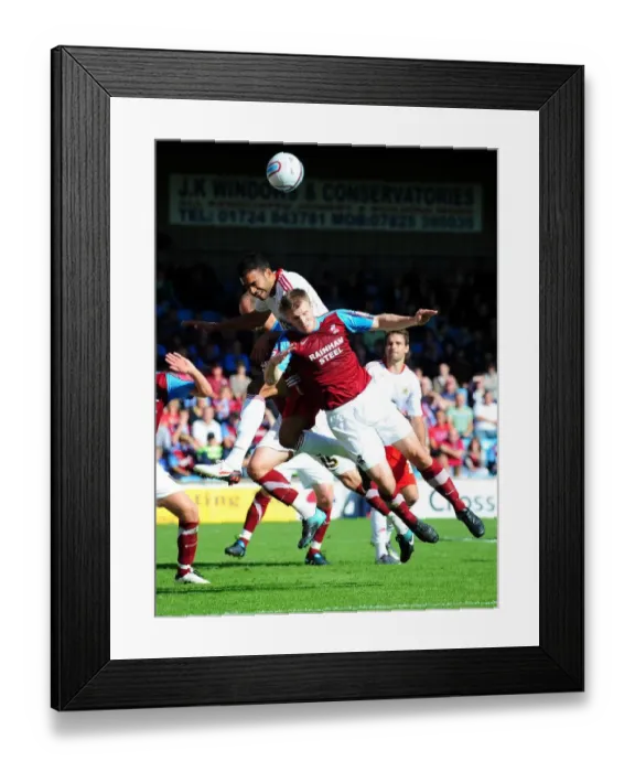 Framed Print : Bristol City's Liam Fontaine vs Scunthorpe's Michael O'Connor: Aerial Battle in Championship Match, September 11, 2010