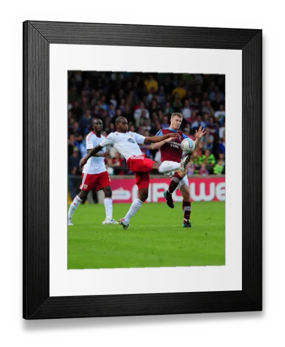 Framed Print : Battling for Control: Elliott vs. O'Connor in Scunthorpe United vs. Bristol City Championship Showdown, September 11, 2010