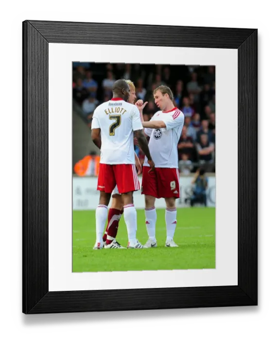 Framed Print : Calming Down the Chaos: David Clarkson Consoles Marvin Elliott During Tense Scunthorpe vs. Bristol City Championship Match, 2010 Framed Print : Calming Down the Chaos: David Clarkson Consoles Marvin Elliott During Tense Scunthorpe vs. Bristol City Championship Match, 2010