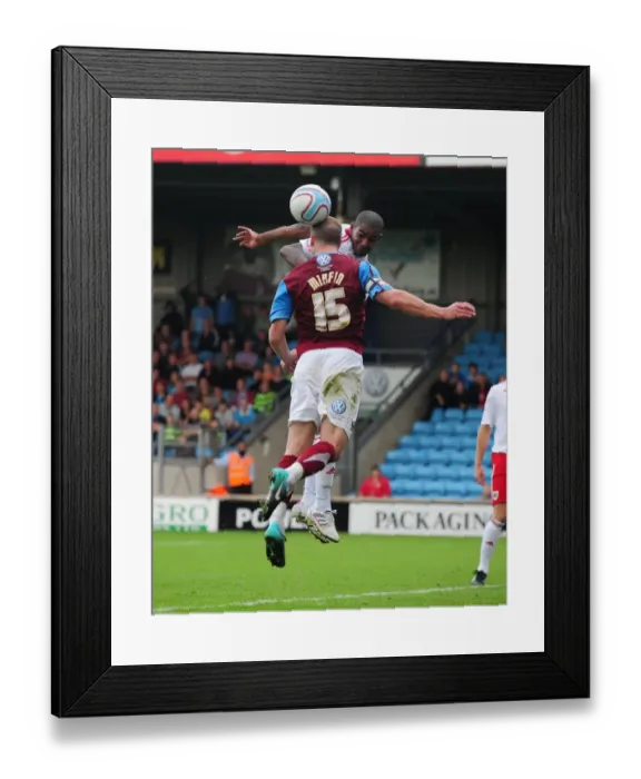 Framed Print : Clash in the Championship: Marvin Elliott vs. David Mirfin - Scunthorpe United vs. Bristol City, 11-09-2010 Framed Print : Clash in the Championship: Marvin Elliott vs. David Mirfin - Scunthorpe United vs. Bristol City, 11-09-2010