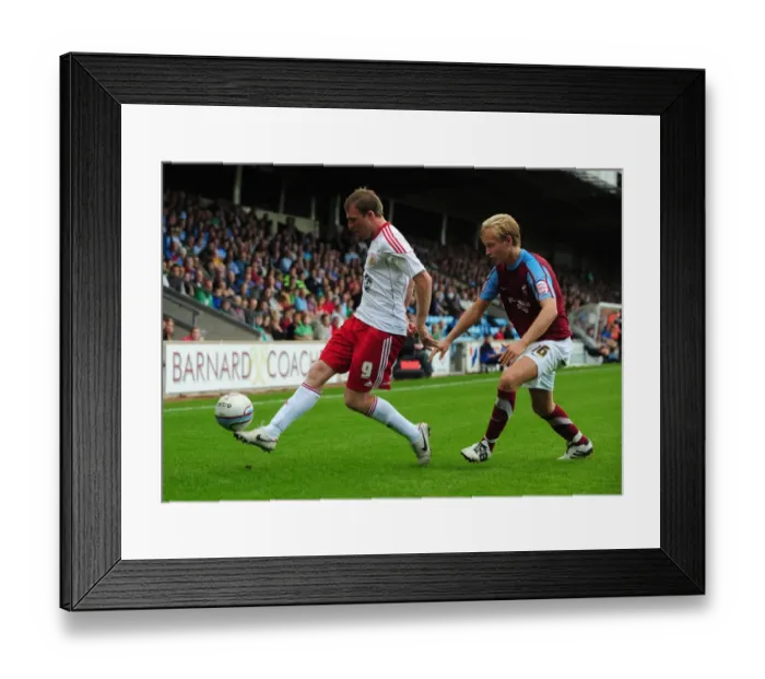 Framed Print : Clash at Glanford Park: David Clarkson vs. Josh Wright in Championship Battle Framed Print : Clash at Glanford Park: David Clarkson vs. Josh Wright in Championship Battle