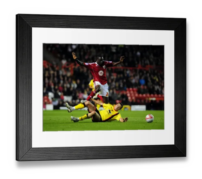 Framed Print : Bristol City's Albert Adomah Fouled by Don Cowie in Championship Match against Watford (14.09.2010) Framed Print : Bristol City's Albert Adomah Fouled by Don Cowie in Championship Match against Watford (14.09.2010)