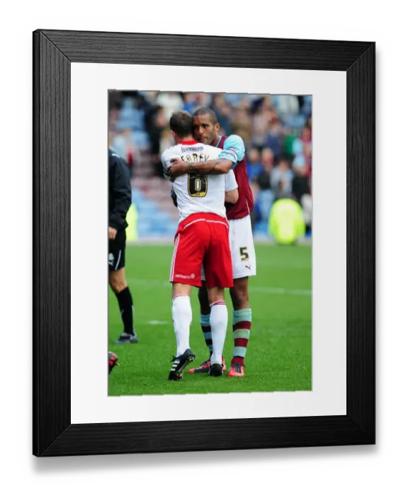 Framed Print : Championship Clash: Burnley and Bristol City Captains Embrace Victory at Turf Moor (August 2010)