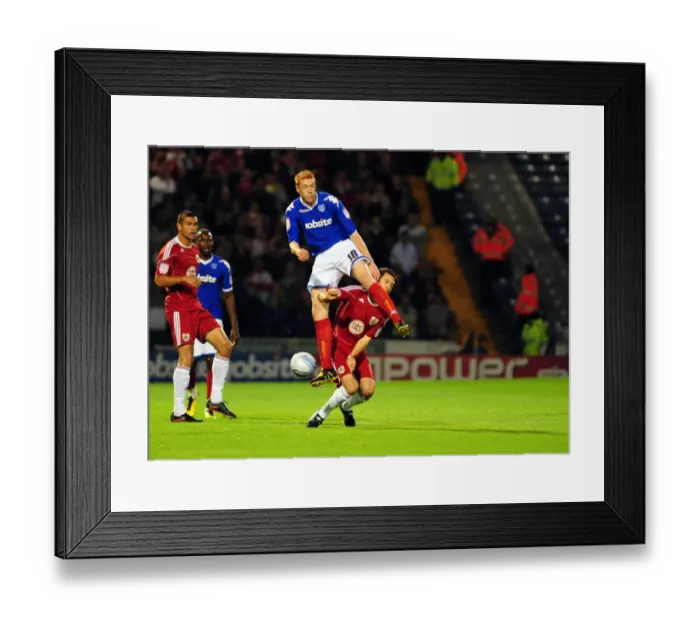 Framed Print : Clash at Fratton Park: Cole Skuse vs. Dave Kitson - Portsmouth vs. Bristol City, Championship Football, 2010