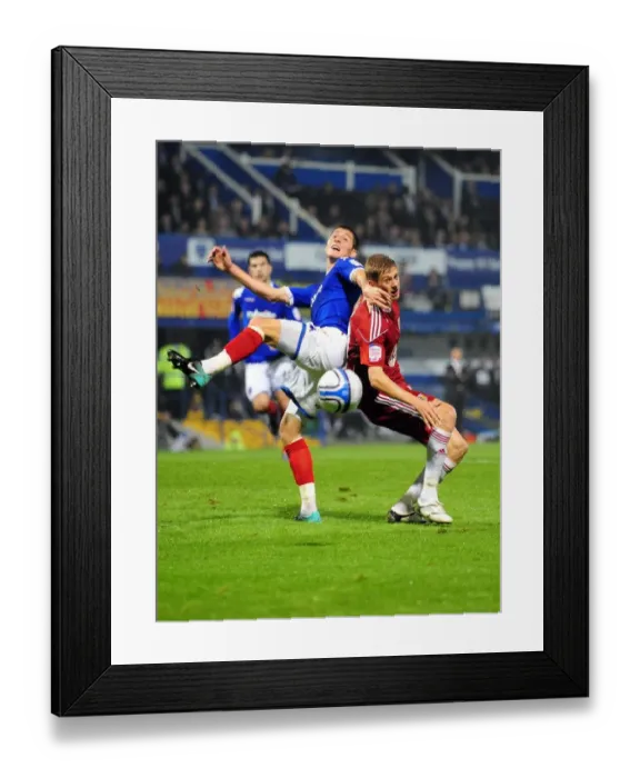 Framed Print : Bristol City's Jon Stead vs. Portsmouth's Joel Ward: Championship Clash at Fratton Park (September 2010)