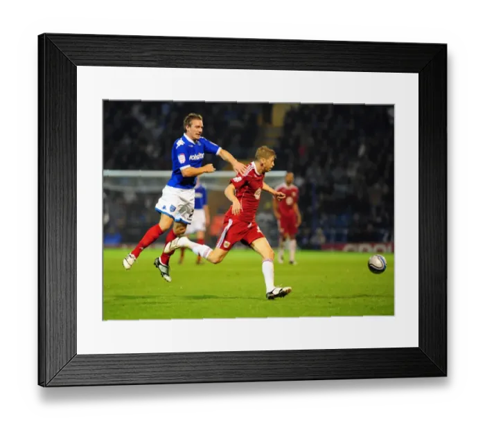 Framed Print : Battling for Supremacy: Jon Stead vs. Liam Lawrence in Portsmouth vs. Bristol City Championship Clash, September 2010 Framed Print : Battling for Supremacy: Jon Stead vs. Liam Lawrence in Portsmouth vs. Bristol City Championship Clash, September 2010