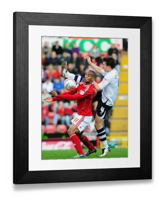 Framed Print : Battling for Supremacy: Haynes vs. St. Ledger in the Championship Clash between Bristol City and Preston North End
